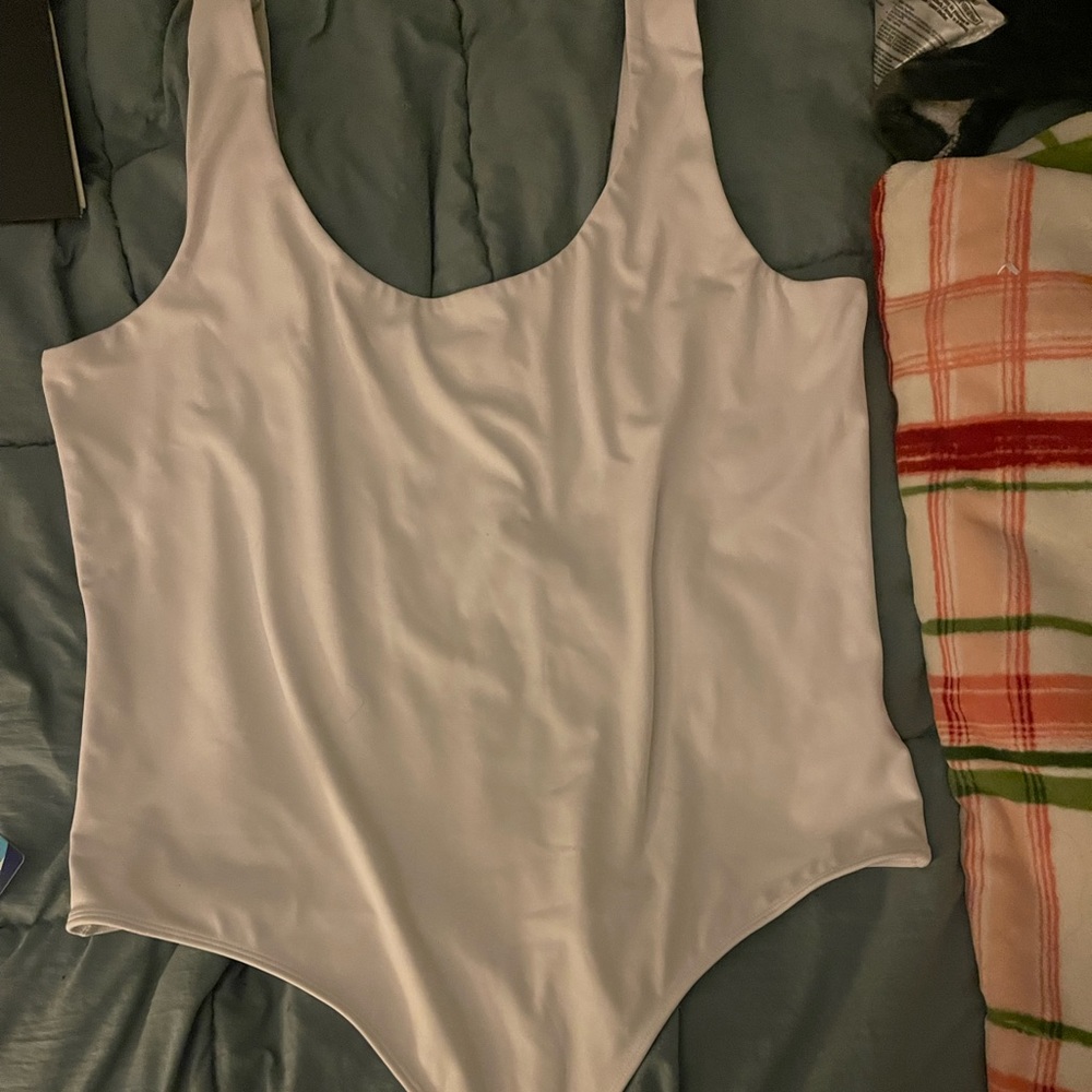 Express tank top body suit size XLon white. Worn 1 time with full panties.